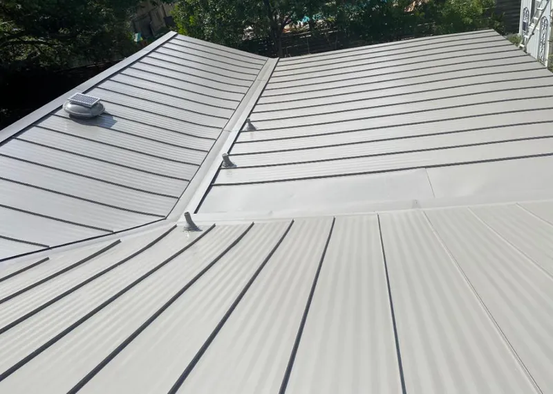 Solar attic fan installed on a metal roof for Roof Ventilation in Fleming Island